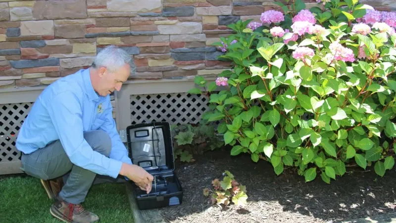 Rodent bait station placement along the foundation of a Purcellville Virginia home in western Loudoun County